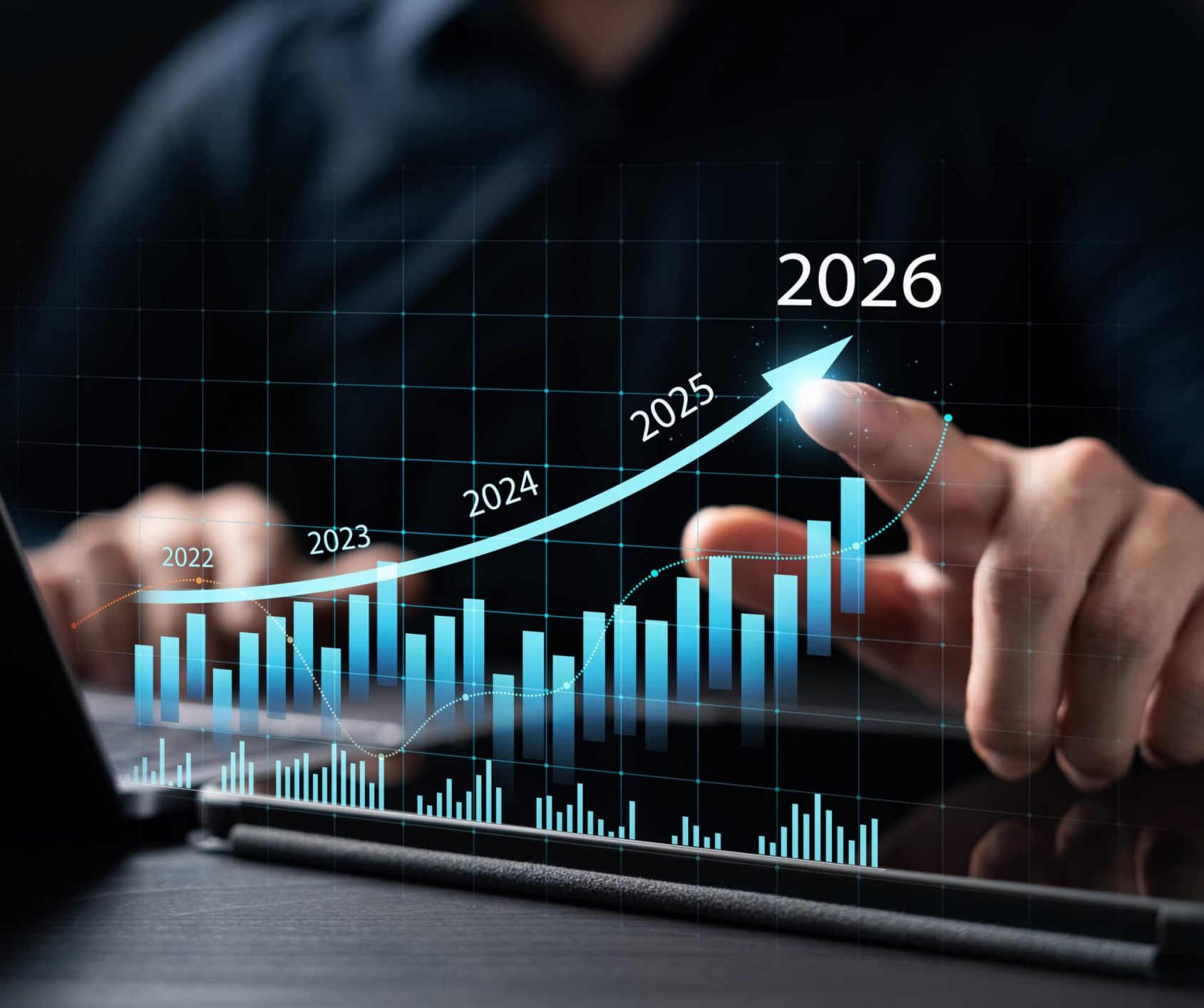 New Business Plan Setting Goals for the New Year 2026, businessman using laptop and tablet to strategize and develop the organization to grow to success in 2026, finding business opportunities.